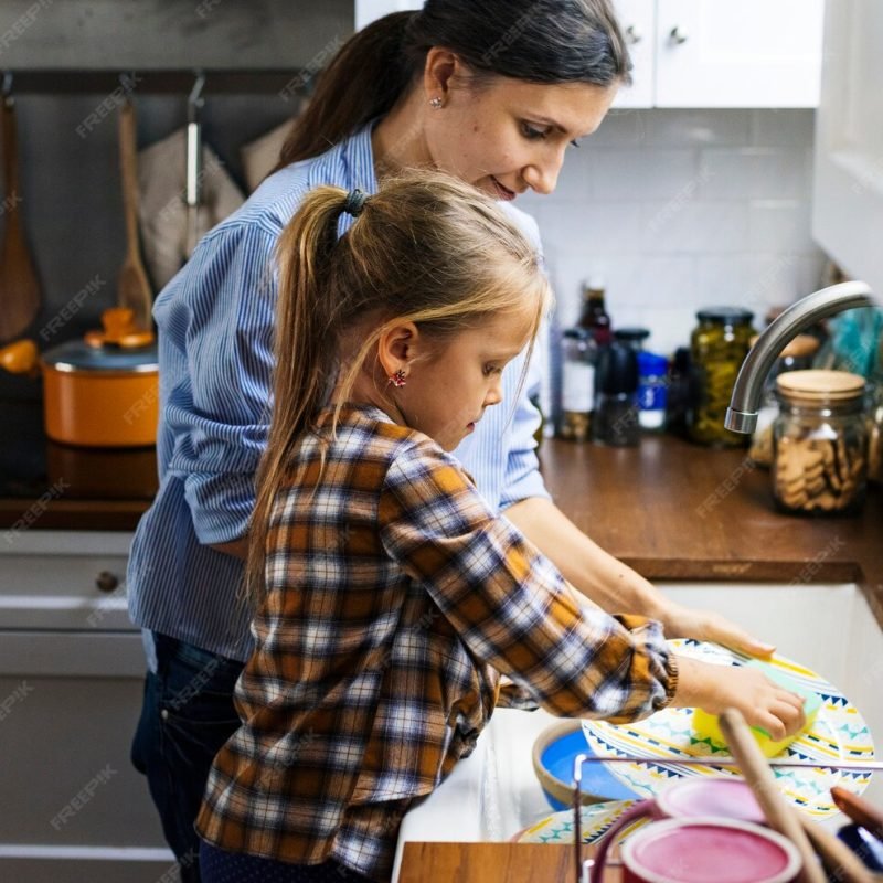 daughter-helping-mom-cleaning-dishes_53876-7268